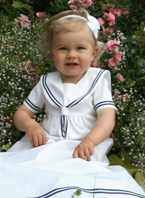 Christening gown in white and navy blue sailor look. Grace of Sweden
